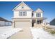 Two-story house with gray siding, brick accents, and a two-car garage at 6196 Granby Dr, Whitestown, IN 46075