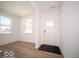 Bright foyer with vinyl plank flooring and access to other rooms at 6196 Granby Dr, Whitestown, IN 46075
