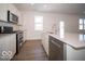 Modern kitchen with stainless steel appliances and large island at 6196 Granby Dr, Whitestown, IN 46075