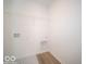 Laundry room with built-in shelving and vinyl flooring at 6196 Granby Dr, Whitestown, IN 46075