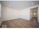 Bright and airy living room with hardwood floors and access to entryway at 6196 Granby Dr, Whitestown, IN 46075
