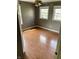 A bright empty bedroom has laminate floors, neutral paint, ceiling fan, and two windows for lots of natural light at 927 Stockton St, Indianapolis, IN 46260
