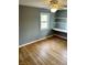 Inviting bedroom featuring a built-in desk area, hardwood floors, and natural light at 927 Stockton St, Indianapolis, IN 46260