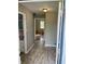 Hallway and entry way showing neutral walls and access to multiple rooms at 927 Stockton St, Indianapolis, IN 46260
