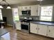 Modern kitchen with stainless steel appliances and white cabinetry at 927 Stockton St, Indianapolis, IN 46260