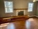 Cozy living room showcasing the fireplace, wood mantel, and built-in bench at 927 Stockton St, Indianapolis, IN 46260