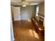Sunlit living room featuring laminate flooring and an elegant, classic fireplace at 927 Stockton St, Indianapolis, IN 46260
