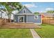 Charming backyard with a spacious wooden deck and a well-maintained lawn at 560 Jefferson Ave, Indianapolis, IN 46201