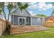 Backyard with a new deck, modern outdoor furniture, privacy fence, and outdoor lighting at 560 Jefferson Ave, Indianapolis, IN 46201