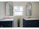 Double vanity bathroom with gold fixtures and marble counters at 560 Jefferson Ave, Indianapolis, IN 46201