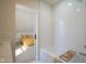 Bathroom with white subway tile, bathtub, and view to bedroom at 560 Jefferson Ave, Indianapolis, IN 46201