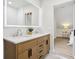 Bathroom featuring double sinks, marble countertops, and an attached bedroom at 560 Jefferson Ave, Indianapolis, IN 46201