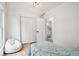 Bedroom with a unicorn beanbag, twin bed, and closet space near the bathroom at 560 Jefferson Ave, Indianapolis, IN 46201