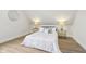 Bedroom with vaulted ceilings, modern decor and neutral walls and wood-look floors at 560 Jefferson Ave, Indianapolis, IN 46201