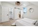 Bright bedroom with a sliding barn door, walk-in closet, and light wood floors at 560 Jefferson Ave, Indianapolis, IN 46201