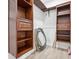 A walk-in closet featuring custom wood shelving and drawers at 560 Jefferson Ave, Indianapolis, IN 46201