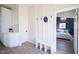 Bright entry with white bench, coat hooks, and view of bedroom at 560 Jefferson Ave, Indianapolis, IN 46201