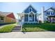 Gray craftsman home with white porch and landscaping at 560 Jefferson Ave, Indianapolis, IN 46201