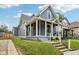 Home exterior featuring a covered porch with steps and a sidewalk leading to the front entrance at 560 Jefferson Ave, Indianapolis, IN 46201