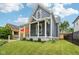 Charming home features a covered front porch with classic columns, enhancing its curb appeal in a friendly neighborhood at 560 Jefferson Ave, Indianapolis, IN 46201