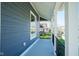 Front porch with gray siding, white trim, and black railing at 560 Jefferson Ave, Indianapolis, IN 46201