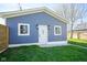 Detached garage with white door and two windows at 560 Jefferson Ave, Indianapolis, IN 46201
