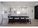 Modern kitchen with white cabinets, quartz counters, and an island at 560 Jefferson Ave, Indianapolis, IN 46201
