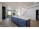 Kitchen island with seating and quartz countertops at 560 Jefferson Ave, Indianapolis, IN 46201