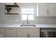 Modern kitchen sink with a gold faucet and quartz countertop at 560 Jefferson Ave, Indianapolis, IN 46201