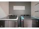 Laundry room with modern washer and dryer set at 560 Jefferson Ave, Indianapolis, IN 46201