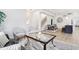 Bright, open-concept living area with hardwood floors, modern decor, and a staircase to the second floor at 560 Jefferson Ave, Indianapolis, IN 46201