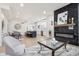 Open-concept space featuring a modern fireplace, an inviting living room, and a stylish kitchen and dining area at 560 Jefferson Ave, Indianapolis, IN 46201