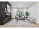 Spacious living room with a fireplace, a large window, and stylish furnishings, offering a welcoming atmosphere at 560 Jefferson Ave, Indianapolis, IN 46201