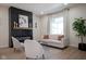 Living room with fireplace, light sofa, and large window at 560 Jefferson Ave, Indianapolis, IN 46201