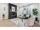 Living room featuring modern fireplace, sleek furniture, and abundant natural light at 560 Jefferson Ave, Indianapolis, IN 46201