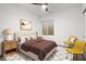 Cozy bedroom featuring neutral tones, plush bedding, and soft lighting for a relaxing atmosphere at 7650 Clarion Dr, Indianapolis, IN 46236