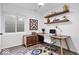 A functional home office with shelves, storage, and a modern desk creates an ideal workspace at 7650 Clarion Dr, Indianapolis, IN 46236