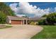 Beautiful brick home with an attached garage and spacious driveway, perfect for a Gathering at 9454 Raintree S Dr, Columbus, IN 47201