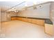 Finished basement featuring long built-in cabinets with countertops and neutral carpeting at 11704 Gray Eagle Dr, Fishers, IN 46037