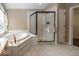 Spa-like bathroom featuring a large shower and corner bathtub at 11704 Gray Eagle Dr, Fishers, IN 46037