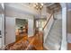 Two-story entry with hardwood floors, staircase, and access to office at 11704 Gray Eagle Dr, Fishers, IN 46037