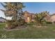 Beautiful brick home with mature landscaping, showcasing its curb appeal at dusk at 11704 Gray Eagle Dr, Fishers, IN 46037