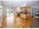 Open kitchen features an island, stainless appliances, granite counters, and an eating area with access to the backyard at 11704 Gray Eagle Dr, Fishers, IN 46037