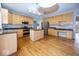 Large kitchen has hardwood flooring, a center island, stainless appliances and lots of counter space at 11704 Gray Eagle Dr, Fishers, IN 46037