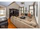 Two-story living room with hardwood floors, fireplace and sectional sofa at 11704 Gray Eagle Dr, Fishers, IN 46037