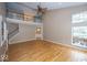Open living room featuring hardwood floors, vaulted ceiling, and a second-story balcony at 11704 Gray Eagle Dr, Fishers, IN 46037
