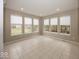 Bright sunroom with neutral tile floors and large windows providing ample light at 11704 Gray Eagle Dr, Fishers, IN 46037