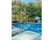 Inviting swimming pool with surrounding landscape at 11704 Gray Eagle Dr, Fishers, IN 46037