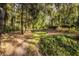 Beautiful backyard with mature trees and manicured landscaping for a tranquil and private outdoor space at 1462 Eagle Trace Ct, Greenwood, IN 46143
