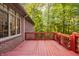 Backyard deck view featuring the red wood deck with a railing and the exterior at 1462 Eagle Trace Ct, Greenwood, IN 46143